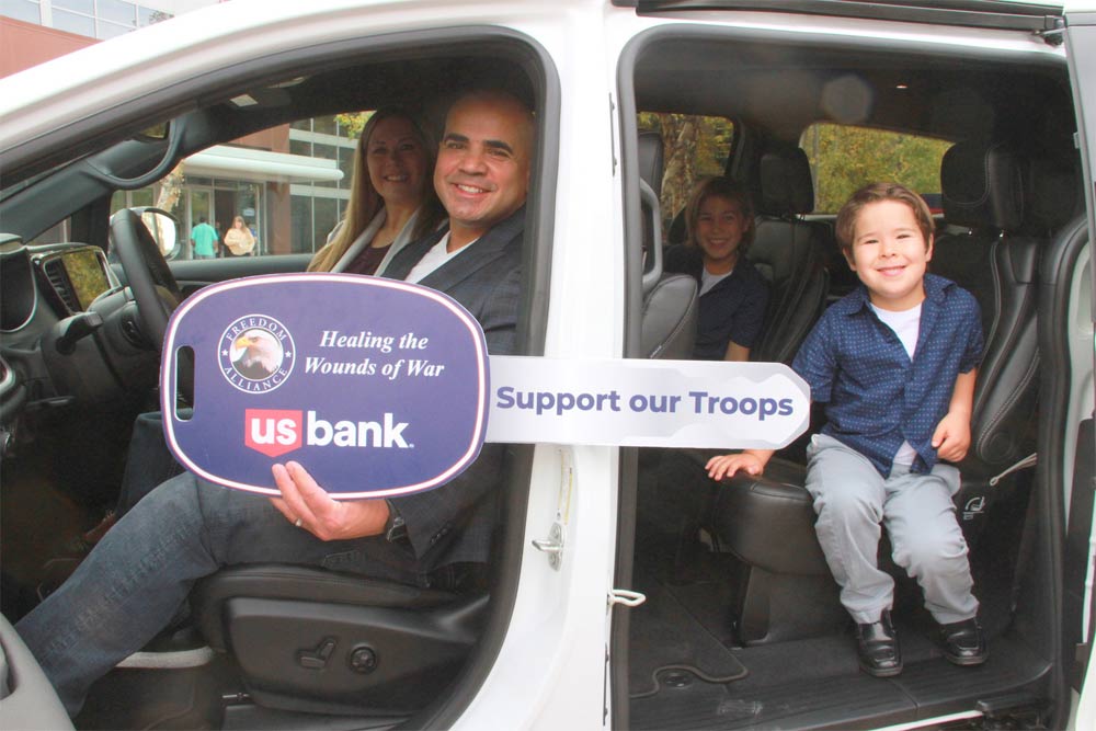 Veteran who received car donation with his family inside vehicle