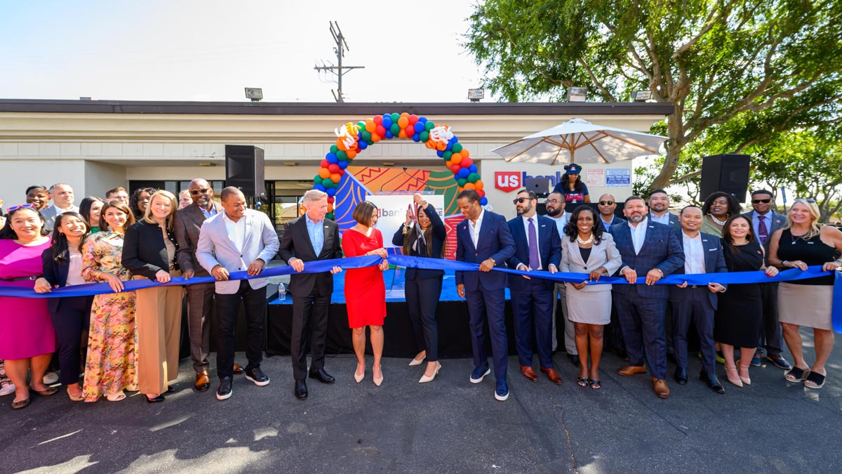 Group of people at a ribbon-cutting ceremony.