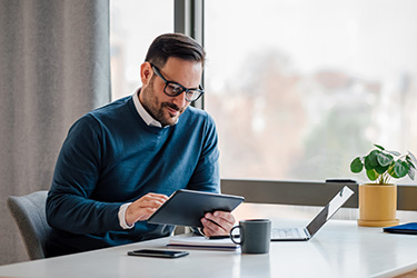 business man using tablet in office