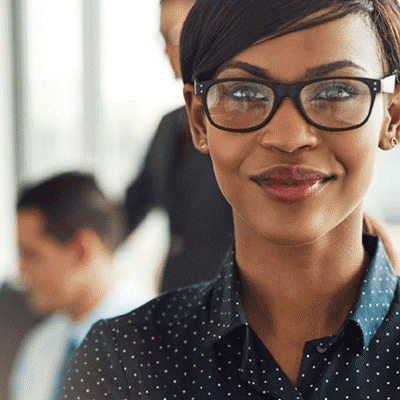 Woman wearing glasses looking straight ahead at the camera