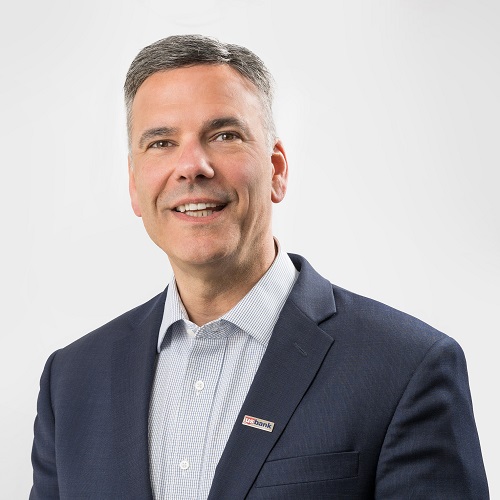 Headshot of Jay Martin wearing a suit and tie