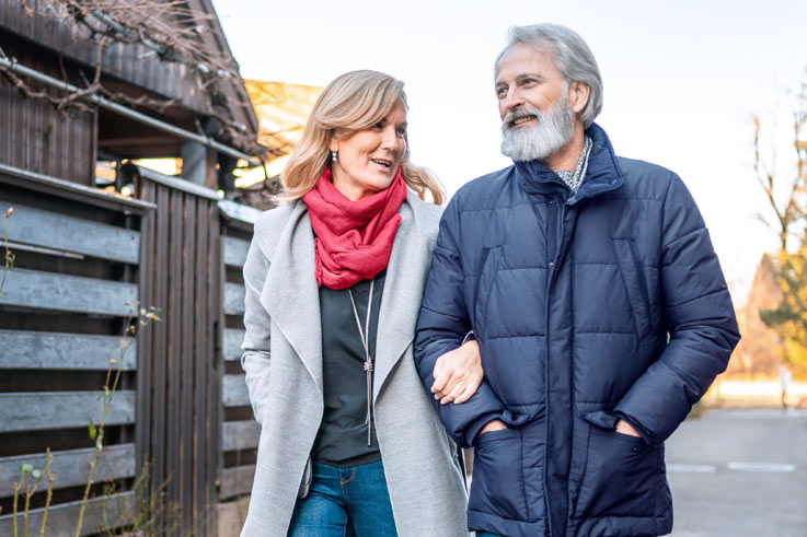 Man and woman walking outside