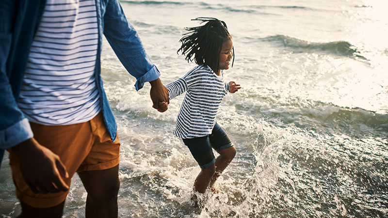 Father and daughter at the beach