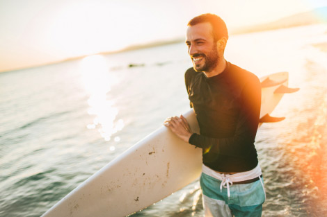 Man holding a surfboard