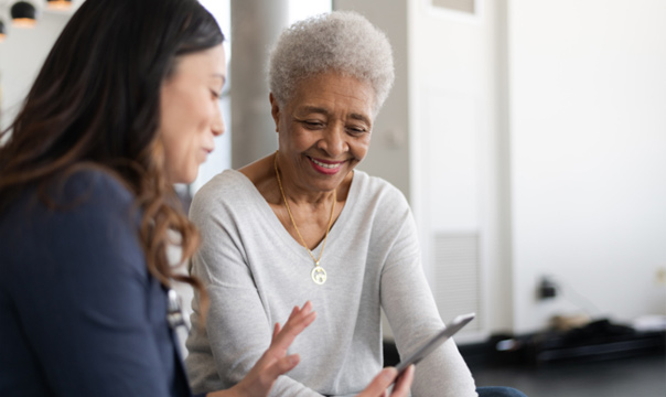 Two women looking at mobile phone