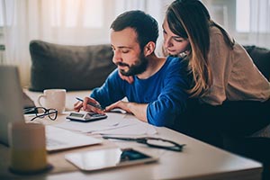 Couple looking at credit card bills