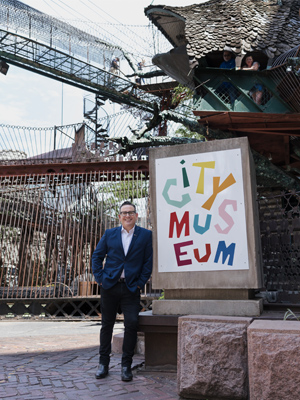 man standing in front of sign