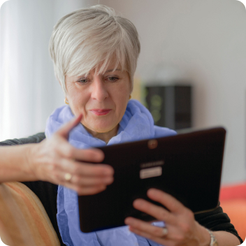 Woman looking at her finances on a tablet computer