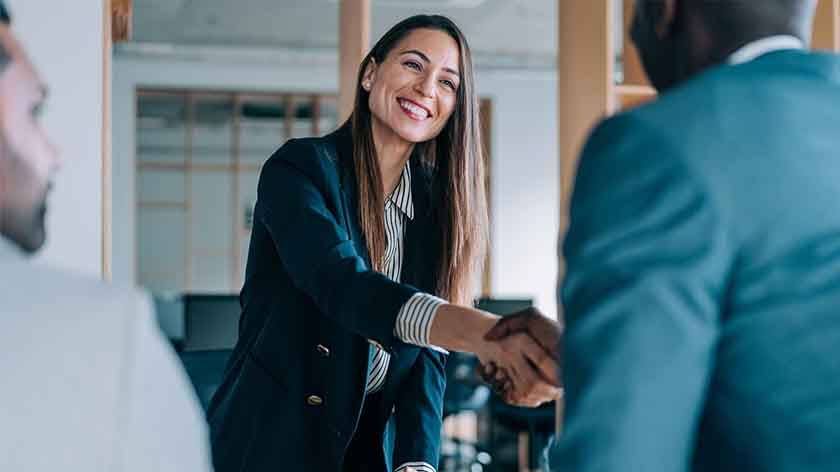 Photo of woman shaking hands